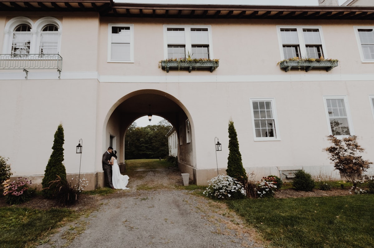Beautiful estate mansion surrounded by manicured gardens perfect for an outdoor ceremony