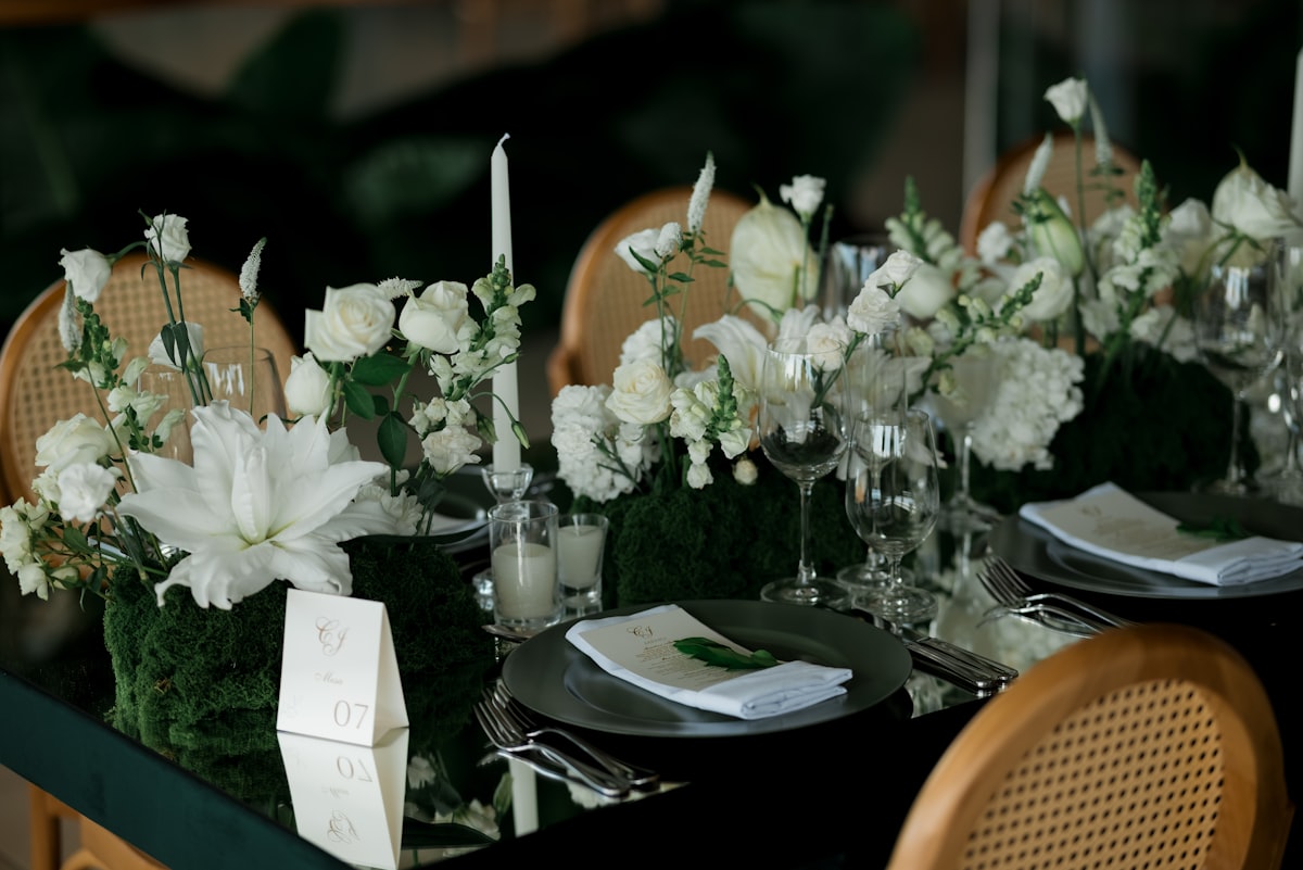 Opulent luxury wedding floral centerpiece with cascading blooms and candles