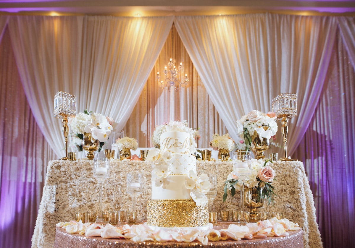Luxurious wedding reception table with gold details and sophisticated styling