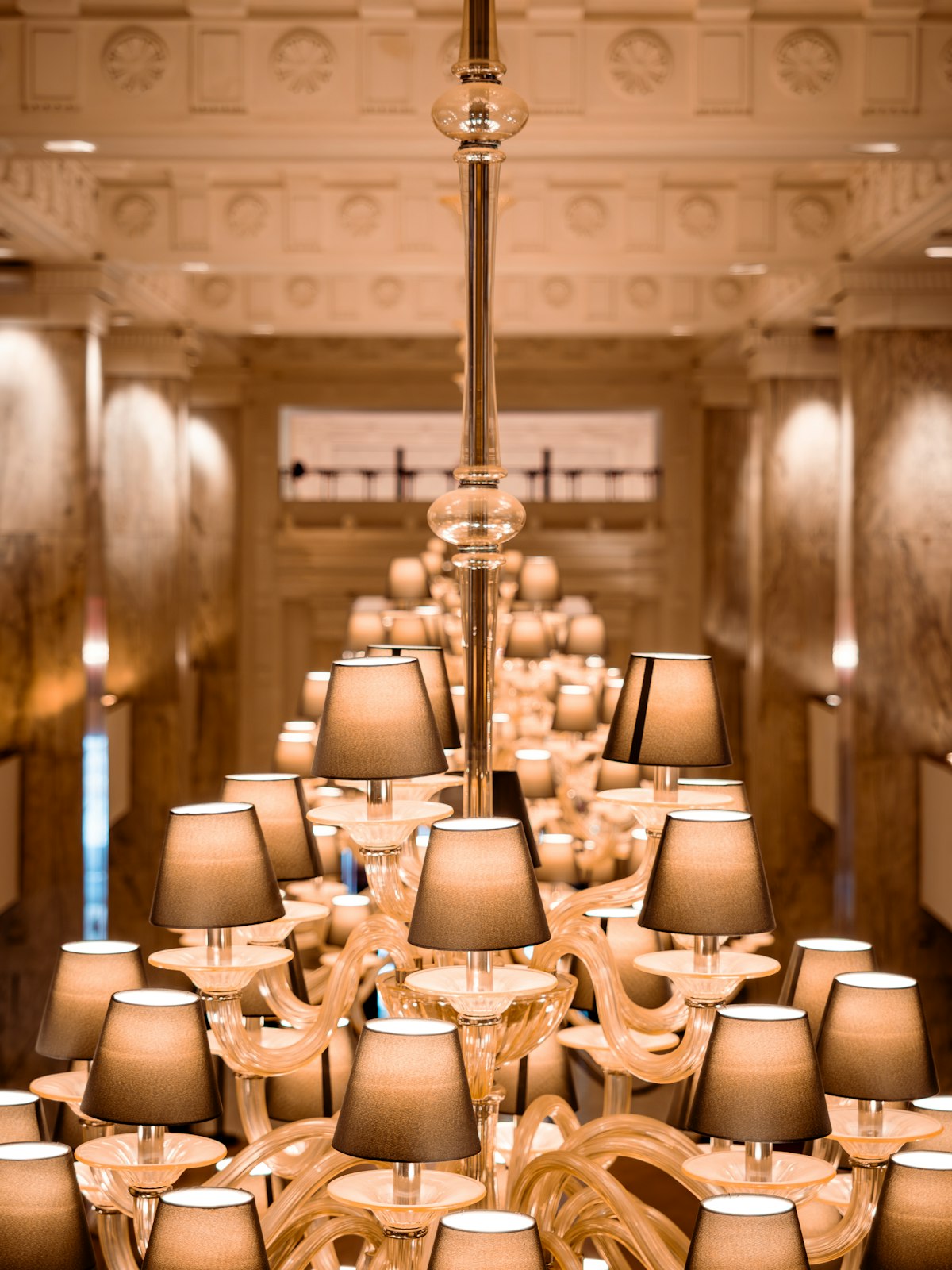 Stunning hotel ballroom decorated for a luxury wedding reception with elegant chandeliers