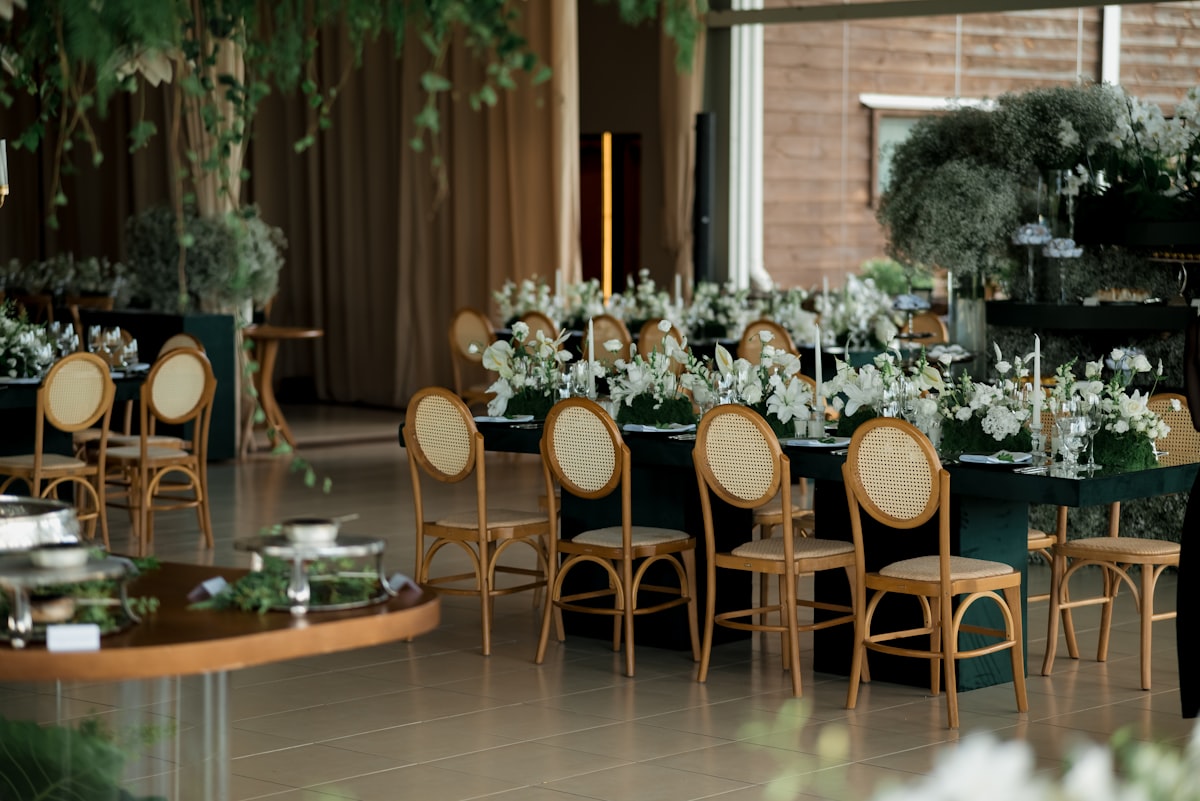 Wedding planner reviewing luxury venue details with elegant decor in the background